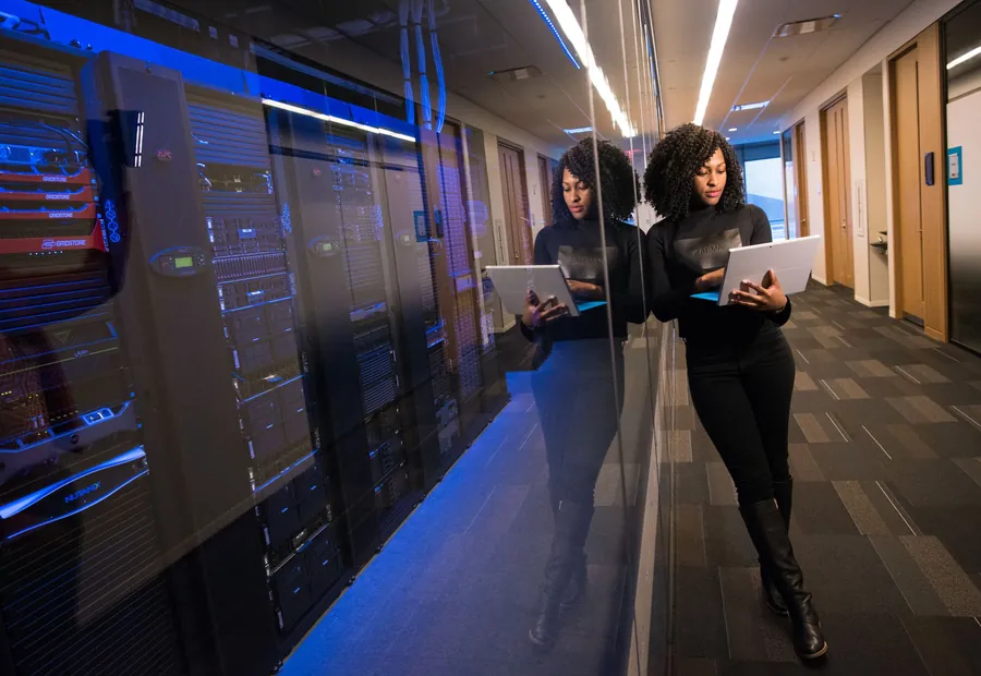 An engineer working in a data centre aisle